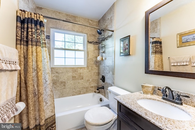 full bathroom featuring vanity, shower / bath combo with shower curtain, and toilet