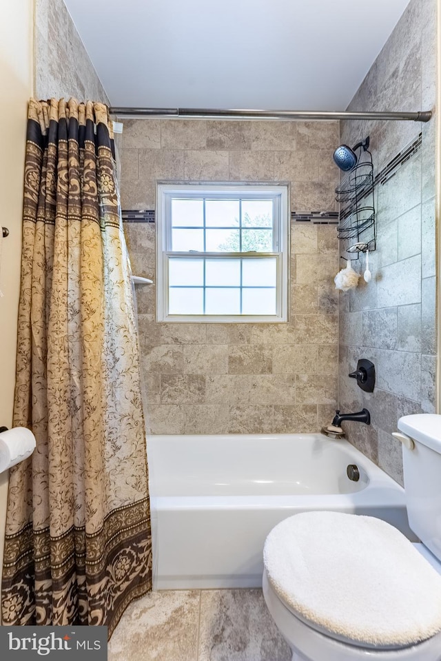 full bathroom with shower / tub combo with curtain and toilet