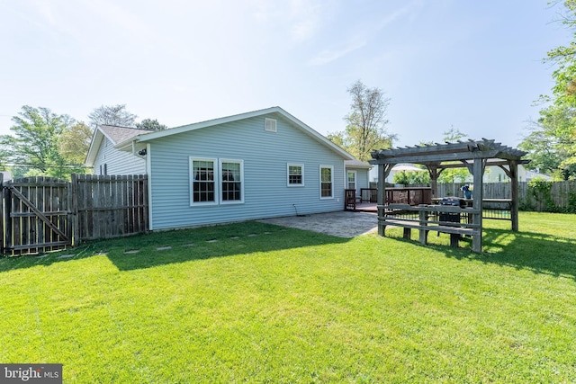back of property with a pergola, a fenced backyard, a gate, a patio area, and a lawn