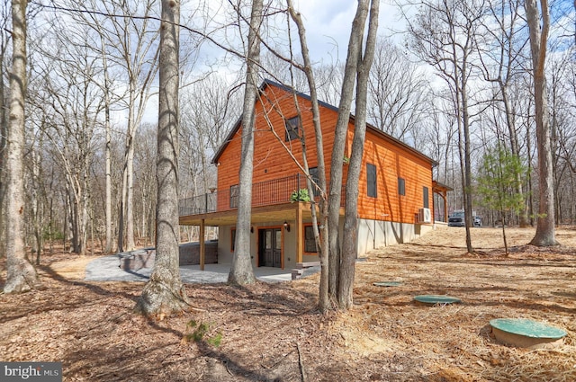5560 Hideaway Ln, Todd, PA 16685 - exterior space with a wooden deck, log veneer siding, and a patio area