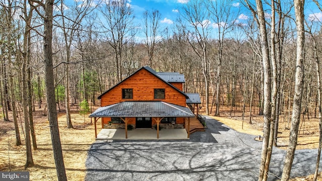 5560 Hideaway Ln, Todd, PA 16685 - back of property with metal roof and a view of trees