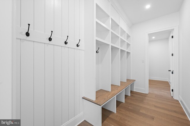 mudroom featuring recessed lighting, baseboards, and wood finished floors