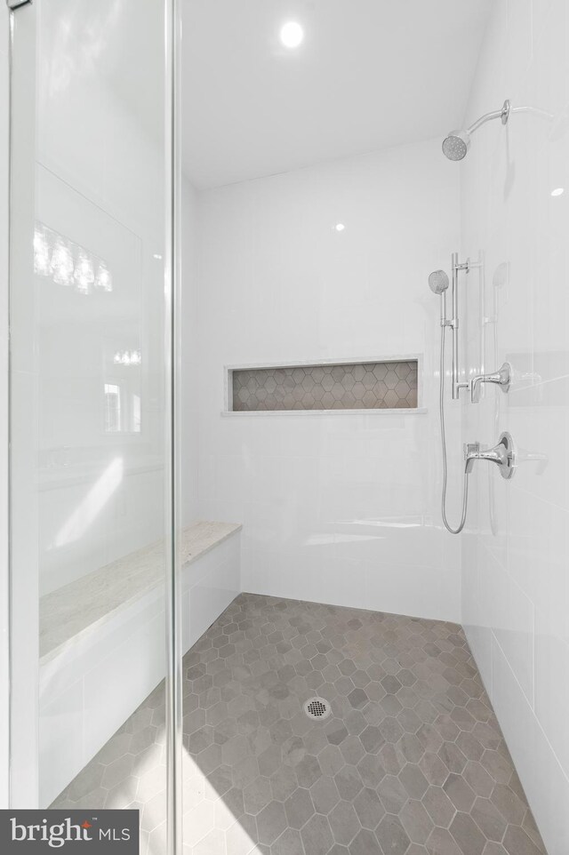 bathroom featuring tile patterned floors and a stall shower