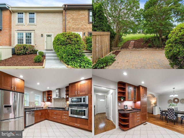 2192 Golf Course Dr, Reston, VA 20191 - kitchen featuring open shelves, appliances with stainless steel finishes, dark countertops, wall chimney range hood, and a sink