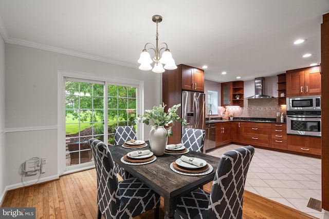 2192 Golf Course Dr, Reston, VA 20191 - dining room with a chandelier, ornamental molding, light wood-style floors, recessed lighting, and baseboards