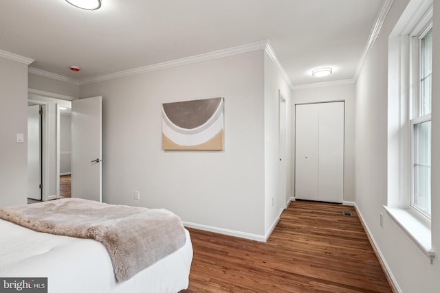 2192 Golf Course Dr, Reston, VA 20191 - bedroom featuring wood finished floors, ornamental molding, baseboards, and multiple windows