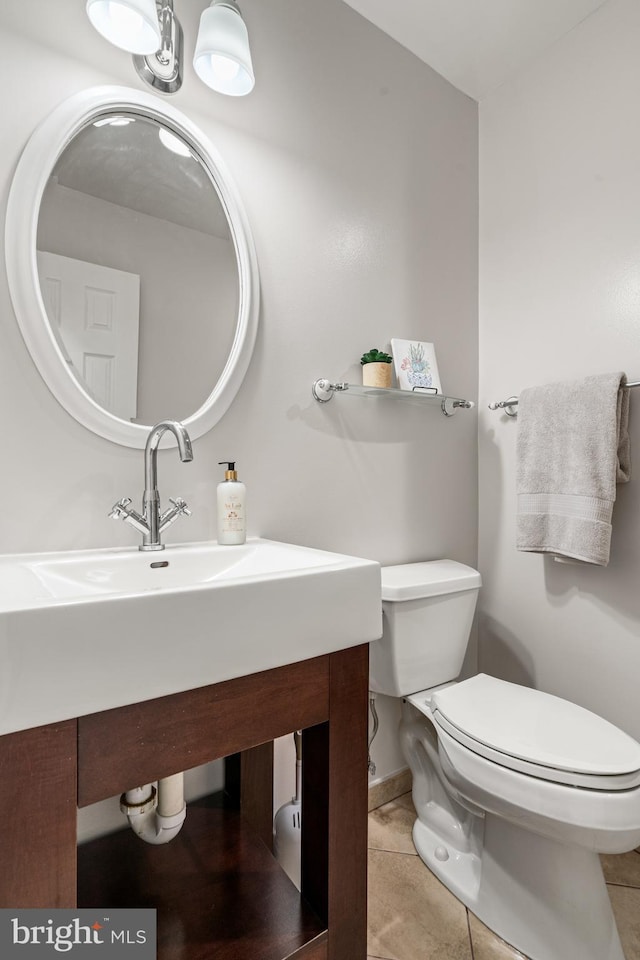 2192 Golf Course Dr, Reston, VA 20191 - bathroom with toilet, vanity, tile patterned floors, and baseboards