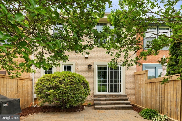 2192 Golf Course Dr, Reston, VA 20191 - rear view of property with entry steps and brick siding