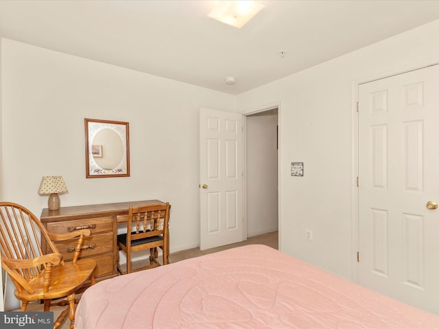 bedroom with carpet floors and baseboards