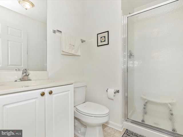 full bath featuring vanity, tile patterned flooring, a shower stall, and toilet