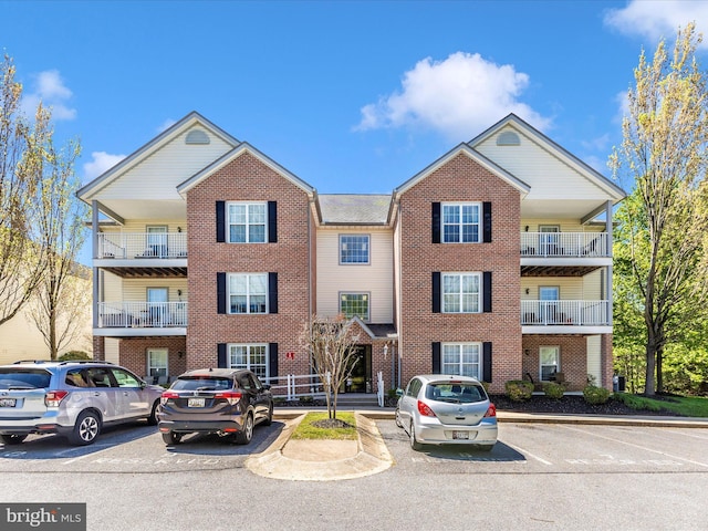 view of property with uncovered parking