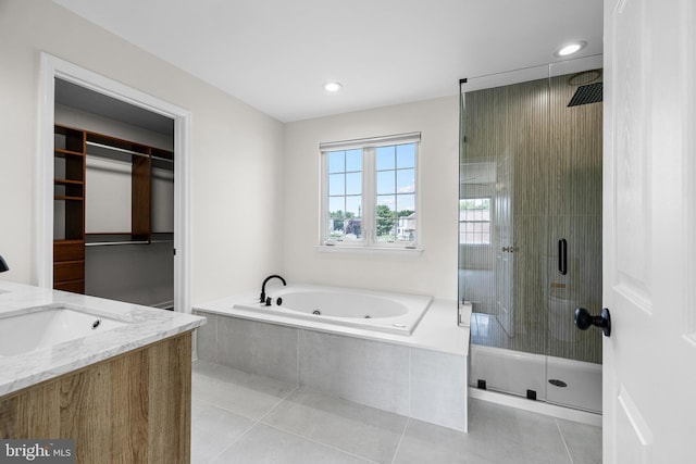 183 Mccormick Blvd, Newark, DE 19702 - bathroom featuring a stall shower, a tub with jets, tile patterned floors, recessed lighting, and vanity