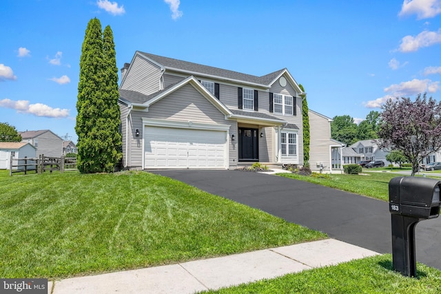 183 Mccormick Blvd, Newark, DE 19702 - traditional-style house featuring asphalt driveway and a garage