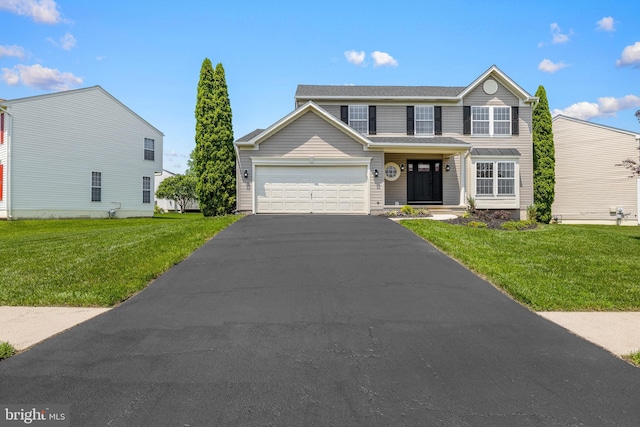 183 Mccormick Blvd, Newark, DE 19702 - view of front facade with driveway, a front yard, and an attached garage