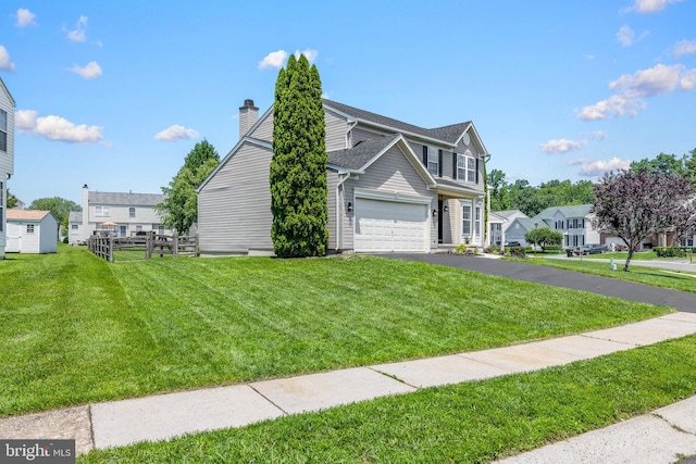 183 Mccormick Blvd, Newark, DE 19702 - view of property exterior featuring asphalt driveway and a chimney