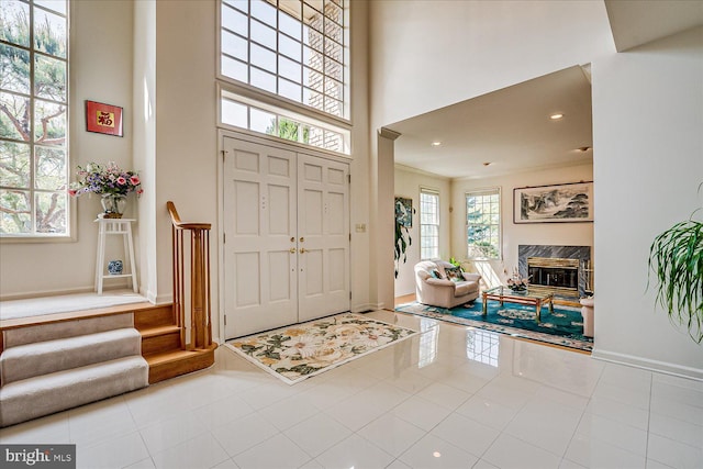 30 Revere Ct, Princeton Junction, NJ 08550 - tiled entryway featuring a high ceiling, a fireplace, recessed lighting, and baseboards