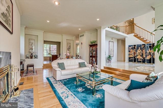 30 Revere Ct, Princeton Junction, NJ 08550 - living area featuring wood finished floors, stairway, recessed lighting, and crown molding