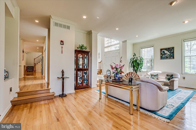 30 Revere Ct, Princeton Junction, NJ 08550 - living area with light wood-style floors, crown molding, stairs, recessed lighting, and baseboards