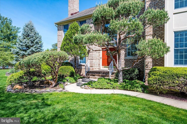30 Revere Ct, Princeton Junction, NJ 08550 - view of front of property featuring a front lawn, a chimney, and brick siding