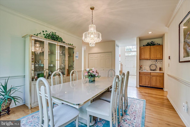 30 Revere Ct, Princeton Junction, NJ 08550 - dining space featuring a chandelier, light wood-style flooring, and ornamental molding