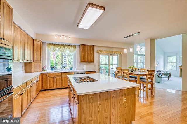 30 Revere Ct, Princeton Junction, NJ 08550 - kitchen with stovetop with downdraft, light wood finished floors, healthy amount of natural light, and light countertops