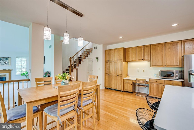 30 Revere Ct, Princeton Junction, NJ 08550 - dining space featuring stairs, recessed lighting, light wood finished floors, and a fireplace