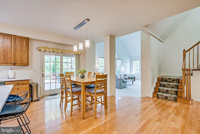 30 Revere Ct, Princeton Junction, NJ 08550 - dining space featuring light wood-style flooring, stairway, and lofted ceiling