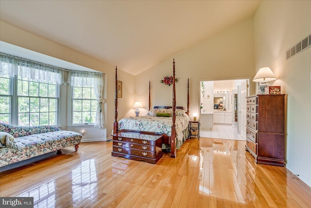 30 Revere Ct, Princeton Junction, NJ 08550 - bedroom with light wood finished floors, baseboards, ensuite bathroom, and high vaulted ceiling