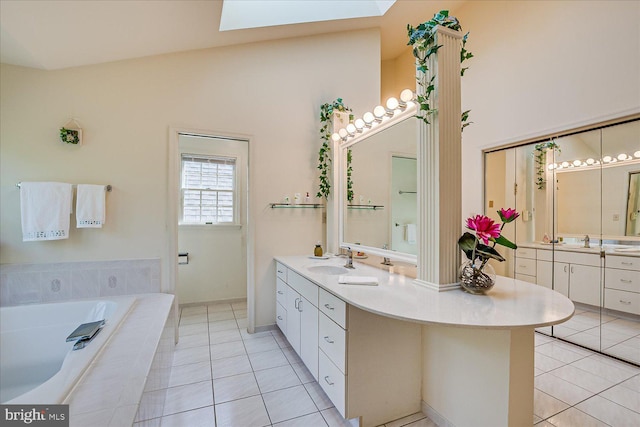 30 Revere Ct, Princeton Junction, NJ 08550 - bathroom featuring tile patterned floors, vanity, a bath, and a skylight