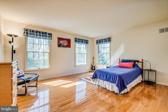30 Revere Ct, Princeton Junction, NJ 08550 - bedroom featuring multiple windows, light wood-type flooring, and baseboards