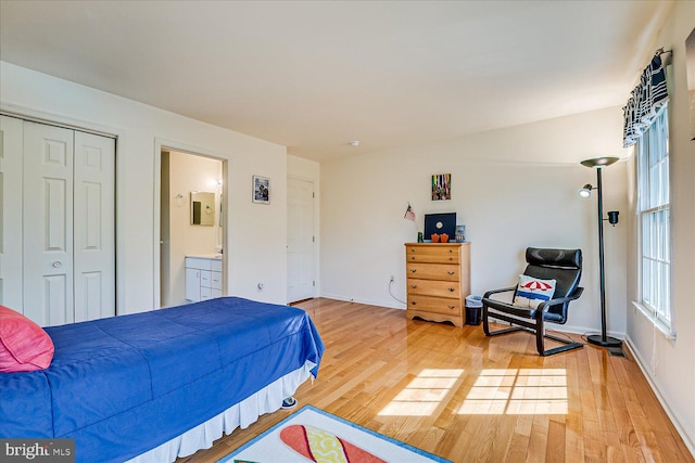 30 Revere Ct, Princeton Junction, NJ 08550 - bedroom with light wood finished floors, ensuite bathroom, a closet, and baseboards