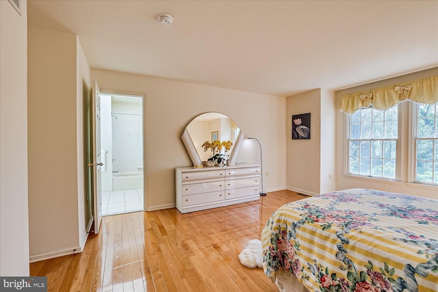 30 Revere Ct, Princeton Junction, NJ 08550 - bedroom with light wood-style floors, baseboards, and connected bathroom