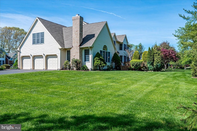 30 Revere Ct, Princeton Junction, NJ 08550 - view of front of home featuring a garage, a chimney, driveway, and a front lawn