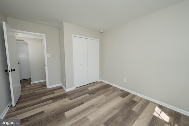 7199 Spotsylvania St, Warrenton, VA 20187 - unfurnished bedroom with baseboards, wood finished floors, and a closet
