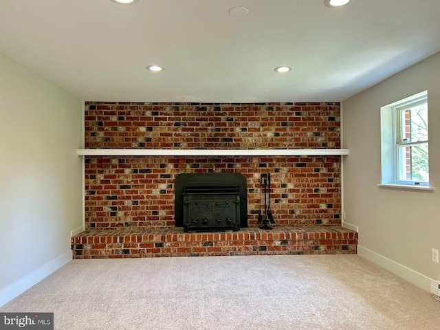 unfurnished living room featuring baseboards, carpet flooring, and recessed lighting
