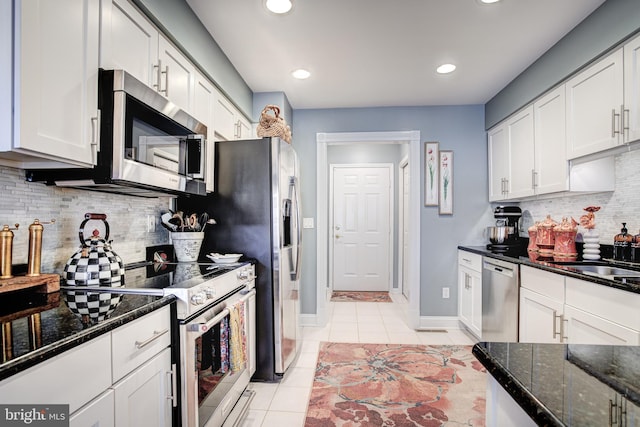 kitchen with white cabinets, stainless steel appliances, and a sink