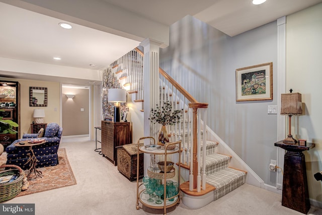 stairway featuring carpet floors, recessed lighting, baseboards, and ornate columns