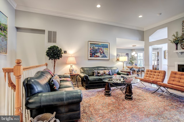 living room featuring visible vents, recessed lighting, crown molding, and wood finished floors