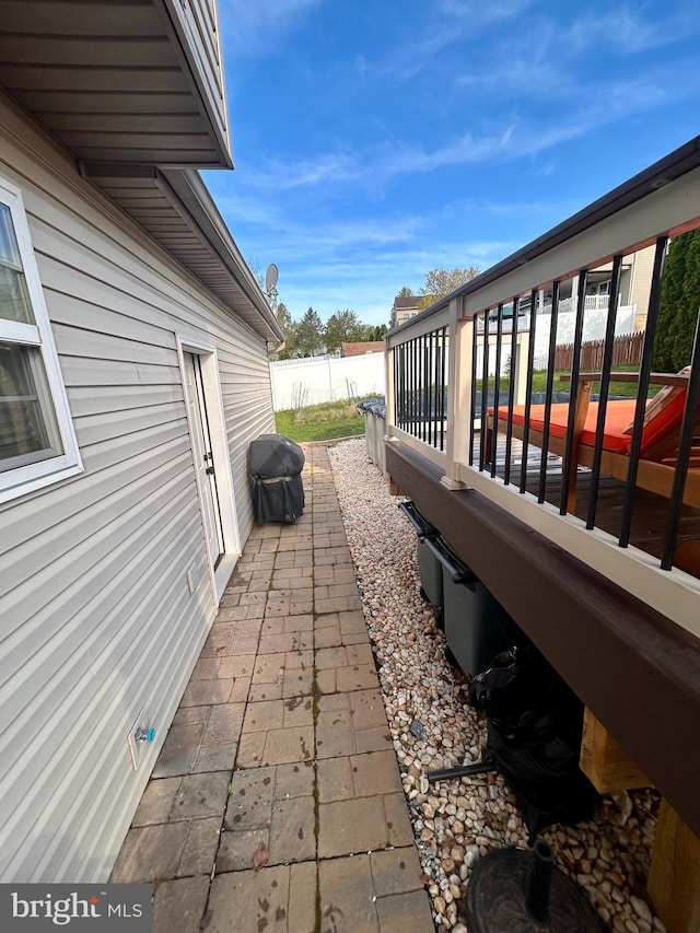view of patio / terrace featuring fence