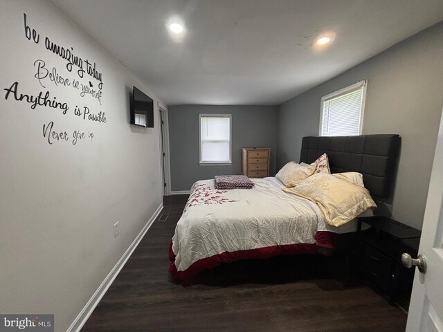 bedroom featuring recessed lighting, baseboards, multiple windows, and dark wood-style floors