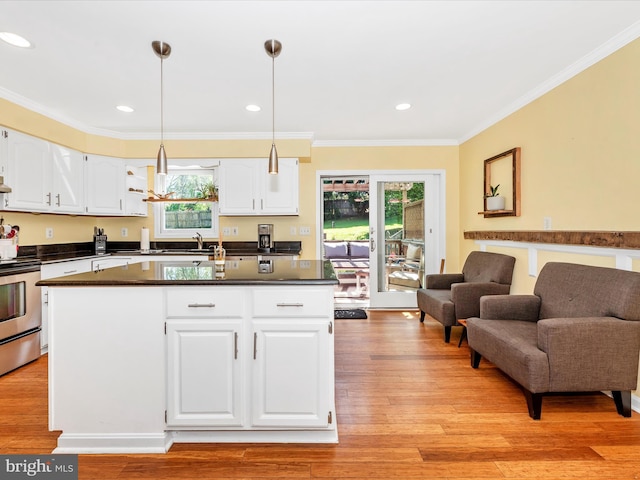 7915 Mount Pleasant Ct E, Walkersville, MD 21793 - kitchen with white cabinets, dark countertops, an island with sink, and stainless steel range with electric stovetop