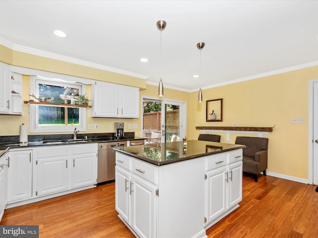 7915 Mount Pleasant Ct E, Walkersville, MD 21793 - kitchen with stainless steel dishwasher, crown molding, dark countertops, a center island, and light wood finished floors