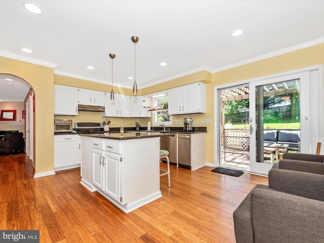 7915 Mount Pleasant Ct E, Walkersville, MD 21793 - kitchen featuring dark countertops, arched walkways, stainless steel appliances, open floor plan, and under cabinet range hood