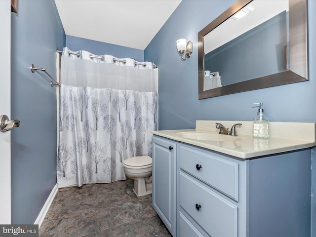 7915 Mount Pleasant Ct E, Walkersville, MD 21793 - full bath with stone finish flooring, vanity, baseboards, toilet, and a shower with shower curtain