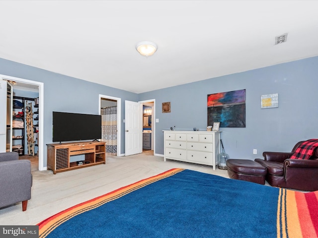 7915 Mount Pleasant Ct E, Walkersville, MD 21793 - bedroom with a walk in closet, visible vents, baseboards, a closet, and ensuite bath