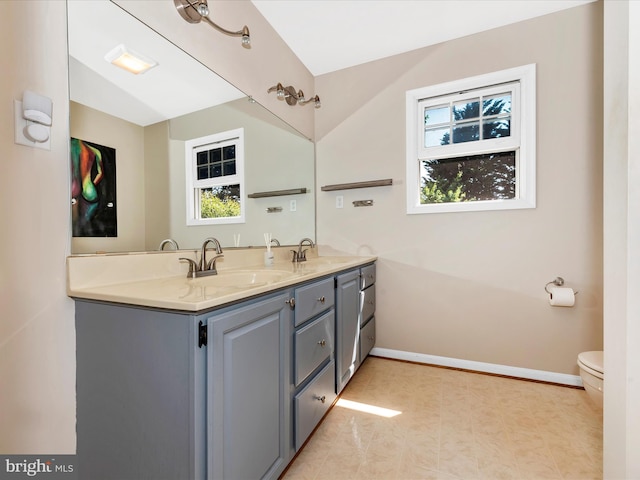 7915 Mount Pleasant Ct E, Walkersville, MD 21793 - full bathroom with a sink, baseboards, toilet, and double vanity