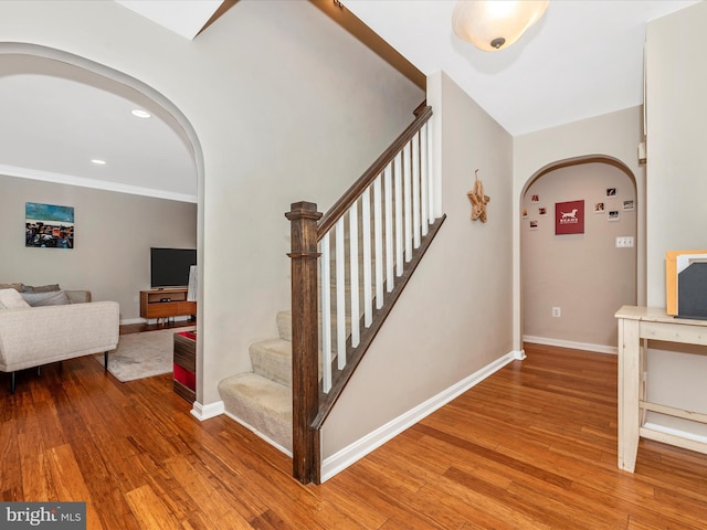 7915 Mount Pleasant Ct E, Walkersville, MD 21793 - staircase with arched walkways, baseboards, recessed lighting, and wood finished floors