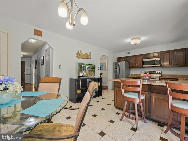 dining room with arched walkways