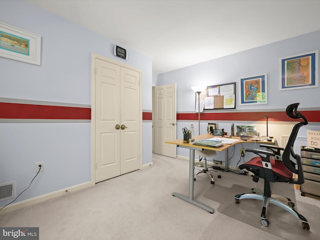 carpeted home office featuring baseboards and visible vents