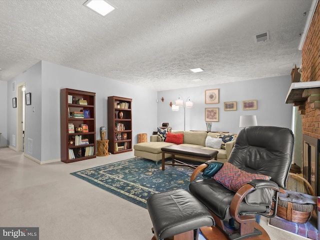 carpeted living room with visible vents, a textured ceiling, a brick fireplace, and baseboards